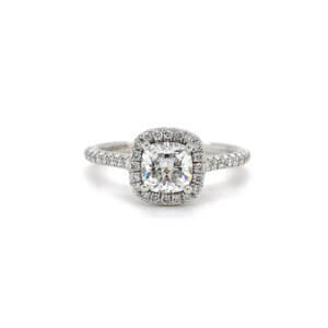 Pre-Owned 0.77ct Cushion cut Diamond Engagement ring with Diamond set halo and shoulders made in Platinum